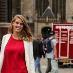 Woman with red and white top outside picture
